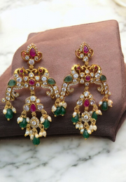 Beautiful earrings with uncut stone and ruby , green colour stones